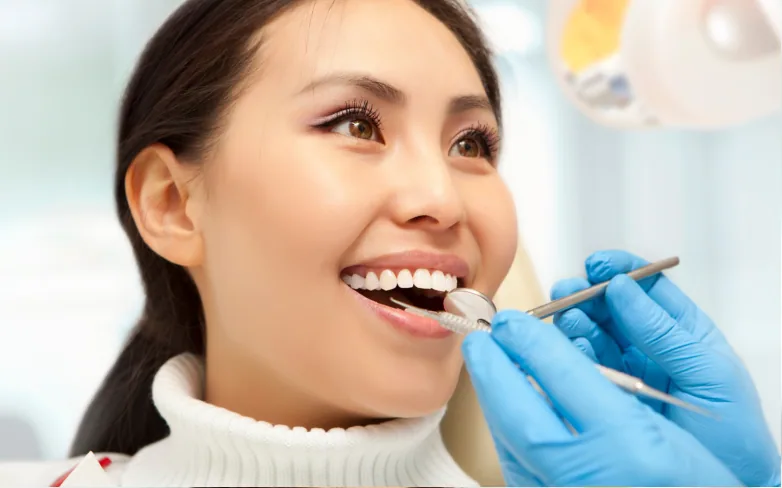 A smiling woman having a dental check-up